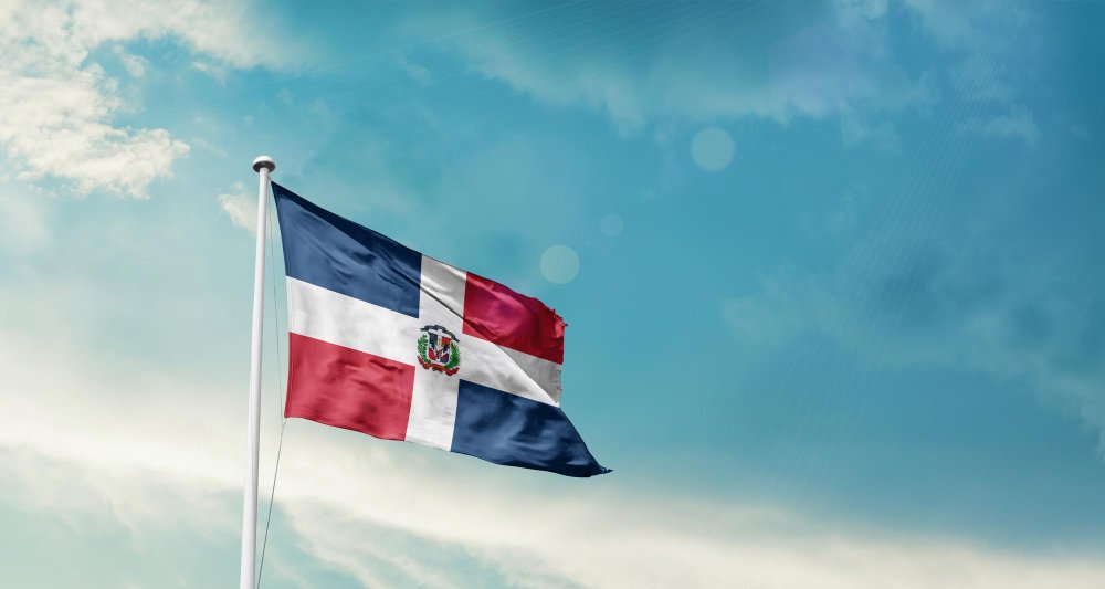 Dominican Republic national flag waving in the sky